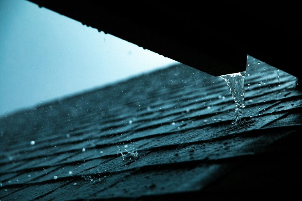Close-up of rain guttering along a tiled roof