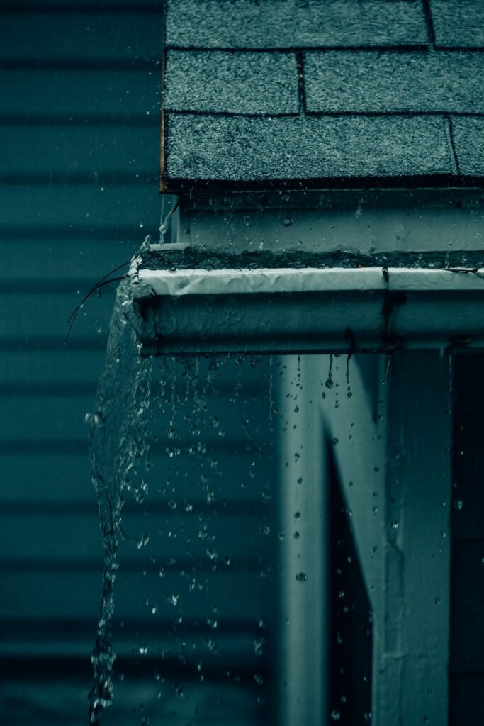 Rain falling from a roof edge