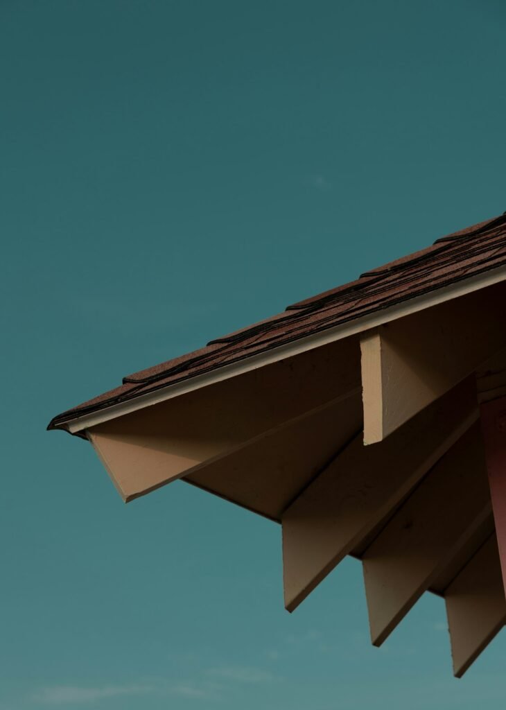 Roofline and fascia against a clear blue sky